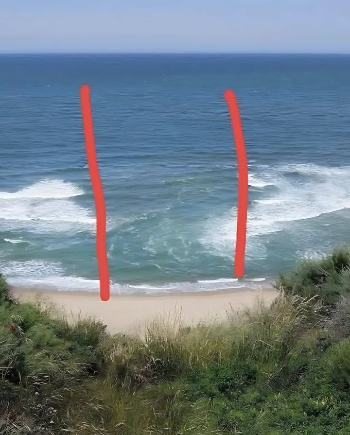 For those unfamiliar with the sea 
Heres a simple but life-saving explanation!

When you see the sea rough and the waves appear split in two like in the photo, do NOT swim! 
 This is caused by rip currents often just called the current.

 If the current pulls you out to sea, getting back to shore will be extremely difficult.
A friendly tip: stay cautious and always be alert. 

 Before setting up your chair and umbrella, take a moment to observe the sea  what you notice could save your life.