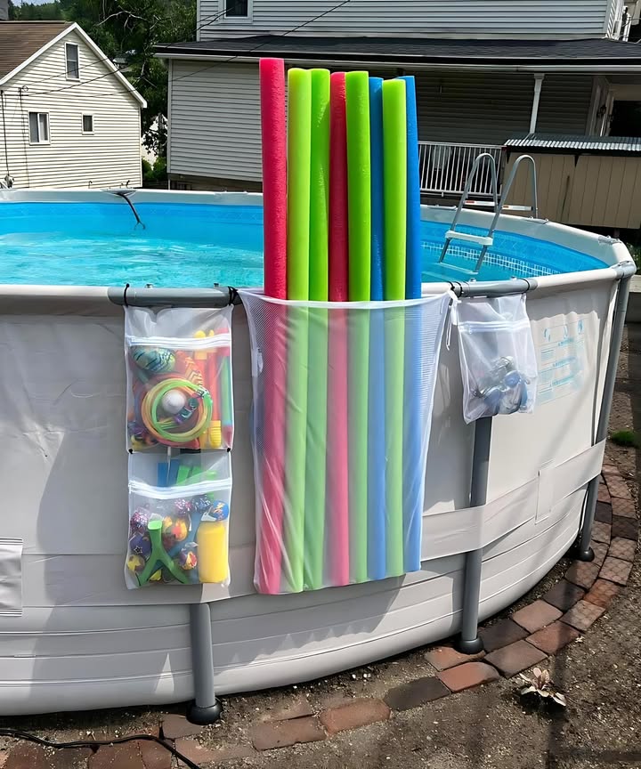 Windproof Pool Noodle Hack: 
1. Use zip bags from Dollar Tree to hold the pool noodles.
2. Purchase drawstring bags from Walmart.
3. Place the zip bags with the pool noodles inside the drawstring bag.
This combination will keep the pool noodles secure and prevent them from falling out, even in windy conditions.
Its an affordable hack to ensure your pool noodles stay in place and dont get blown away.