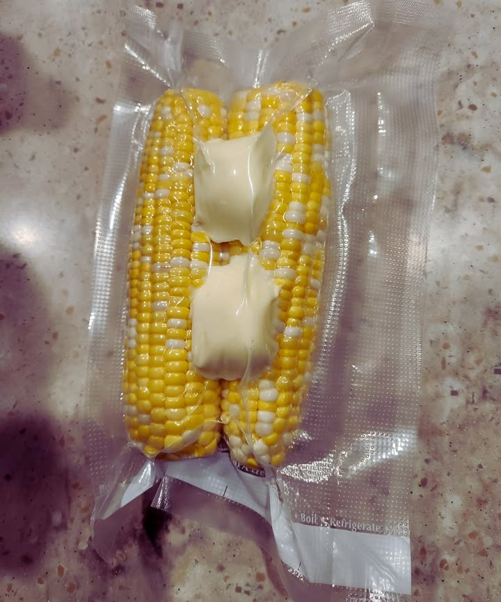 1. Buy corn in season, a couple dozen ears at a time.
2. Place a couple of tablespoons of salted butter on each ear.
3. Vacuum-seal the corn and freeze.
4. When ready to eat, boil the sealed bag for a few minutes.
Enjoy fresh corn on the cob all winter without blanching!