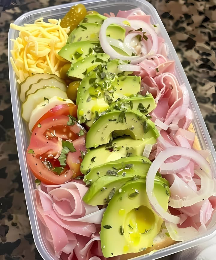 Heres a Perfect Lunch: Sub in a Tub
1. Start with a base of provolone cheese.
2. Add layers of ham, onions, shredded lettuce, avocado, banana peppers, pickles, and tomato.
3. Drizzle with oil and red wine vinegar on top.
4. Sprinkle with oregano.
As always, customize your sub in a tub with your favorite ingredients!
