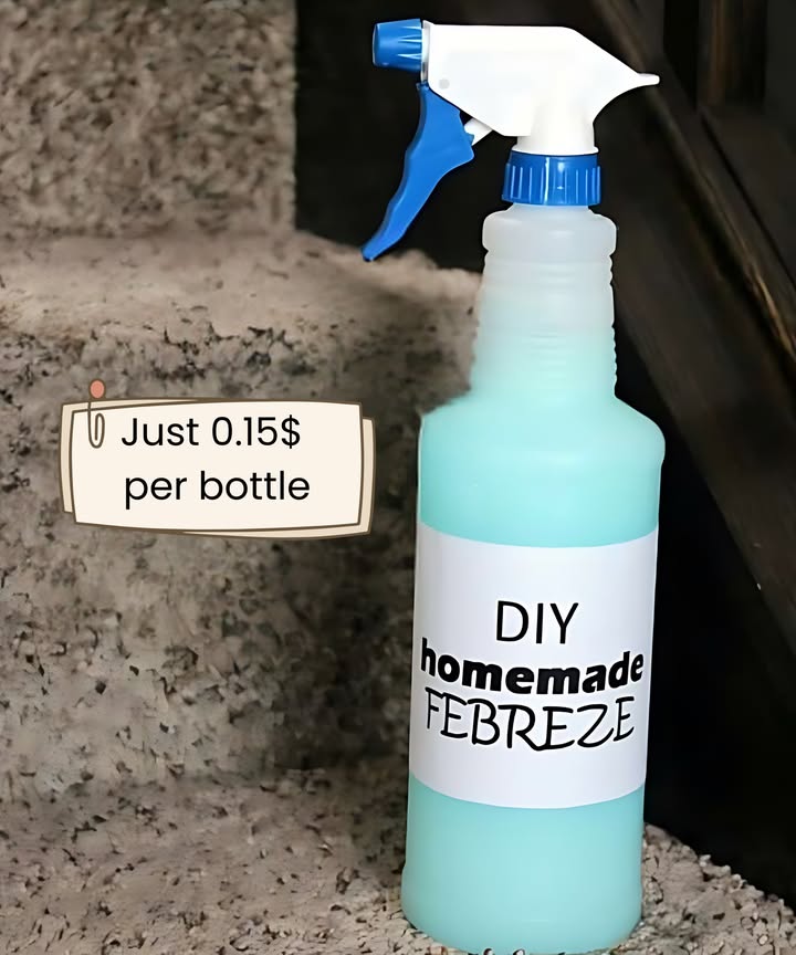 With just 4 ingredients, this DIY Homemade Febreze will keep you on a budget and will leave your home smelling fresh and inviting!
1/2 cup Downy Unstopables scent of your choice
1/4 cup white vinegar
2 caps full rubbing alcohol
water
Tools:
clean spray bottle I use 32 oz.
funnel optional

Step 1: Pour 1/2 cup Downy Unstopables of your choice.  I used the “Fresh” scent.
Step 2: Add 1/4 cup white vinegar.
Step 3: Next, pour in 2 caps full of rubbing alcohol.  This is to help the Febreze dry faster when it is sprayed on carpeting, furniture, etc.
Step 4: Add warm water until your spray bottle is full.  
Step 5: With the sprayer in place, swirl the mixture around until the Unstopables are completely dissolved.  I mixed mine every 10-15 minutes, and they were completely dissolved in about an hour.