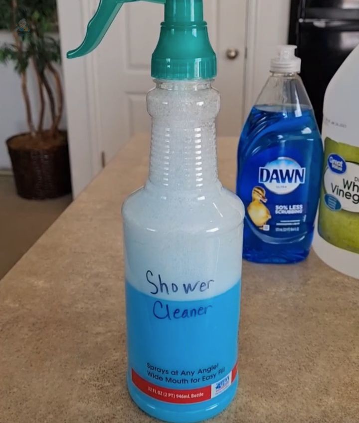 2 Ingredients DIY Shower Cleaner: Natural, Effective, and Budget-Friendly!
Ingredients:
1 cup of warm vinegar
1 cup of Original Blue Dawn dish soap
Instructions:
1. Warm the vinegar: Measure 1 cup of vinegar and warm it in the microwave for 2 minutes.
2. Clean the microwave: As the vinegar heats, it softens food residue. Wipe it away with a clean paper towel.
3. Prepare the shower cleaner: Pour the warm vinegar into a spray bottle.
4. Add Dawn dish soap: Measure and add 1 cup of Original Blue Dawn dish soap to the vinegar.
5. Mix well: Shake or mix the solution to combine the vinegar and dish soap thoroughly.
6. Label your homemade cleaner: Create a personal label using paper and a pen.
7. Clean the shower: Spray the solution all over your bathtub or shower and let it sit for about 15 minutes.
8. Scrub and rinse: Use the scrub side of a sponge to work through the tub or shower surface, then rinse and admire the shine!