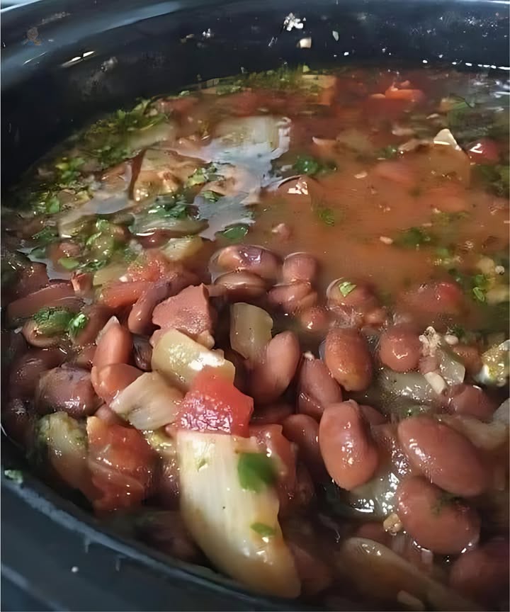 Pinto Beans With Mexican-Style Seasonings 
Ingredients:
1 pound dried pinto beans, rinsed
4 cups water, or as needed
2 10 ounce cans diced tomatoes with green chile peppers such as ROTEL
 pound bacon, cut into 1/2-inch pieces
1 yellow onion, chopped
1 tablespoon chili powder, or to taste
1 tablespoon ground cumin, or to taste
1  teaspoons garlic powder, or to taste
 bunch fresh cilantro, chopped
Salt to taste
Directions:
1. Place pinto beans into a large pot and pour in enough water to cover by 2 to 3 inches. Let beans soak overnight.
2. Drain beans, return to pot, and pour in fresh water to cover; add tomatoes, bacon, onion, chili powder, cumin, and garlic powder. 
3. Bring to a boil, reduce heat to low, and simmer for 3 hours. Check the beans occasionally and add more water if needed.
4. Stir cilantro and salt into beans and simmer until beans are soft, about 1 more hour.
Enjoy!